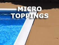 A close up of the edge of a pool with micro toppings