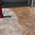 A fire hydrant sitting on top of a cement floor.