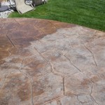 A patio with a brown and tan pattern on it.