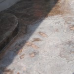 A close up of the steps and floor of a patio.