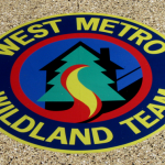 A logo of the west metro wildland team.