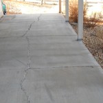 A sidewalk with some kind of crack in it