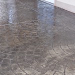 A wet floor with a pattern of water on it