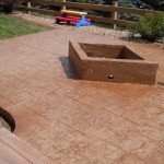 A fire pit sitting on top of a patio.