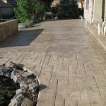 A walkway with stone steps and a water feature.