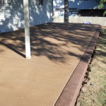 A patio with a tree in the middle of it