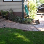 A walkway in the yard of a house