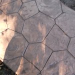 A close up of the pavement in the sun.