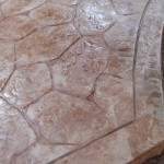 A close up of the floor with cracks and other shapes