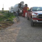 A truck is parked on the side of a road.