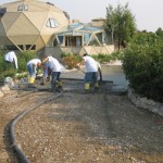 A group of men working on the ground.