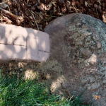 A stone with a brick in the middle of it