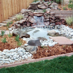 A garden with rocks and water features