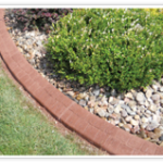 A garden with rocks and grass in the foreground.