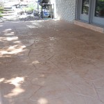 A patio with a large pattern of concrete.