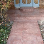 A walkway with steps leading to the front door.