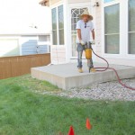 A man standing on the porch of his home