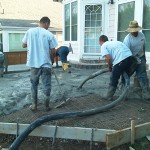 A group of men working on the ground.