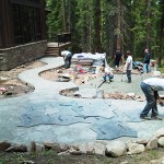 A group of people working on a patio.