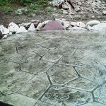 A concrete slab with a hexagonal pattern in the middle of it.