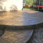 A patio with steps and a fire hydrant.