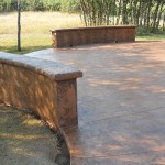 A patio with concrete and brick work.