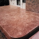 A patio with a large pattern of concrete.