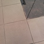 A tile floor with some grout lines on it