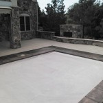 A pool that is covered in white concrete.