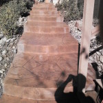 A walkway with steps and stairs leading to the top.