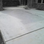 A concrete slab that has been cleaned and is ready for the floor.