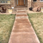 A walkway with steps leading to the front door.