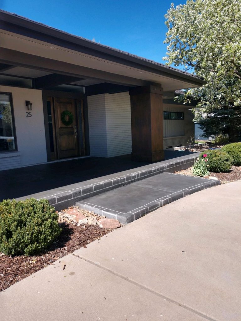 A house with a ramp leading to the front door.