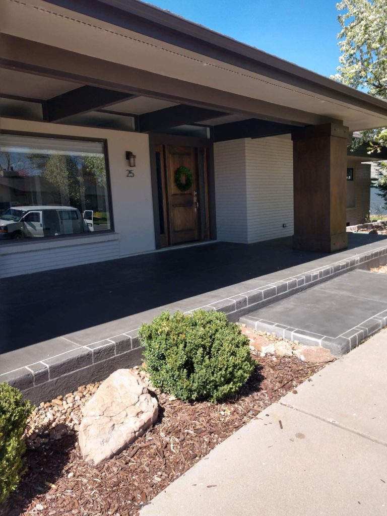 A house with a front porch and a walkway.